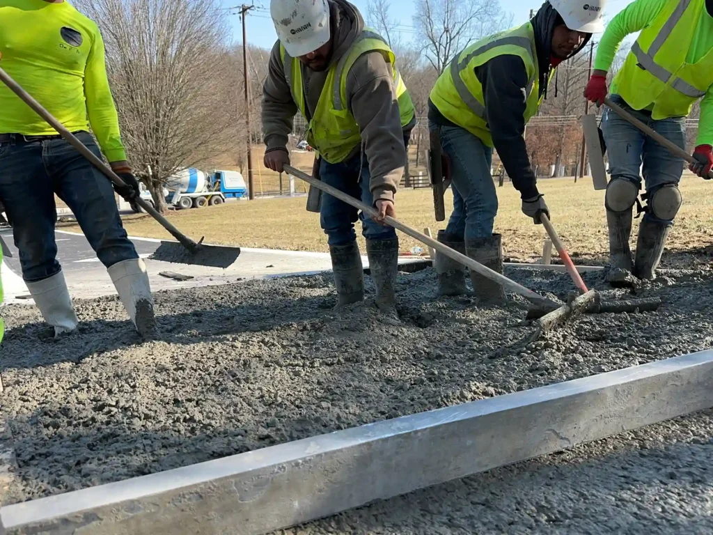 men spreading concrete for project | los pumas concrete nashville